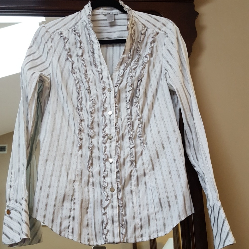 Snap close down with tux style shirt.